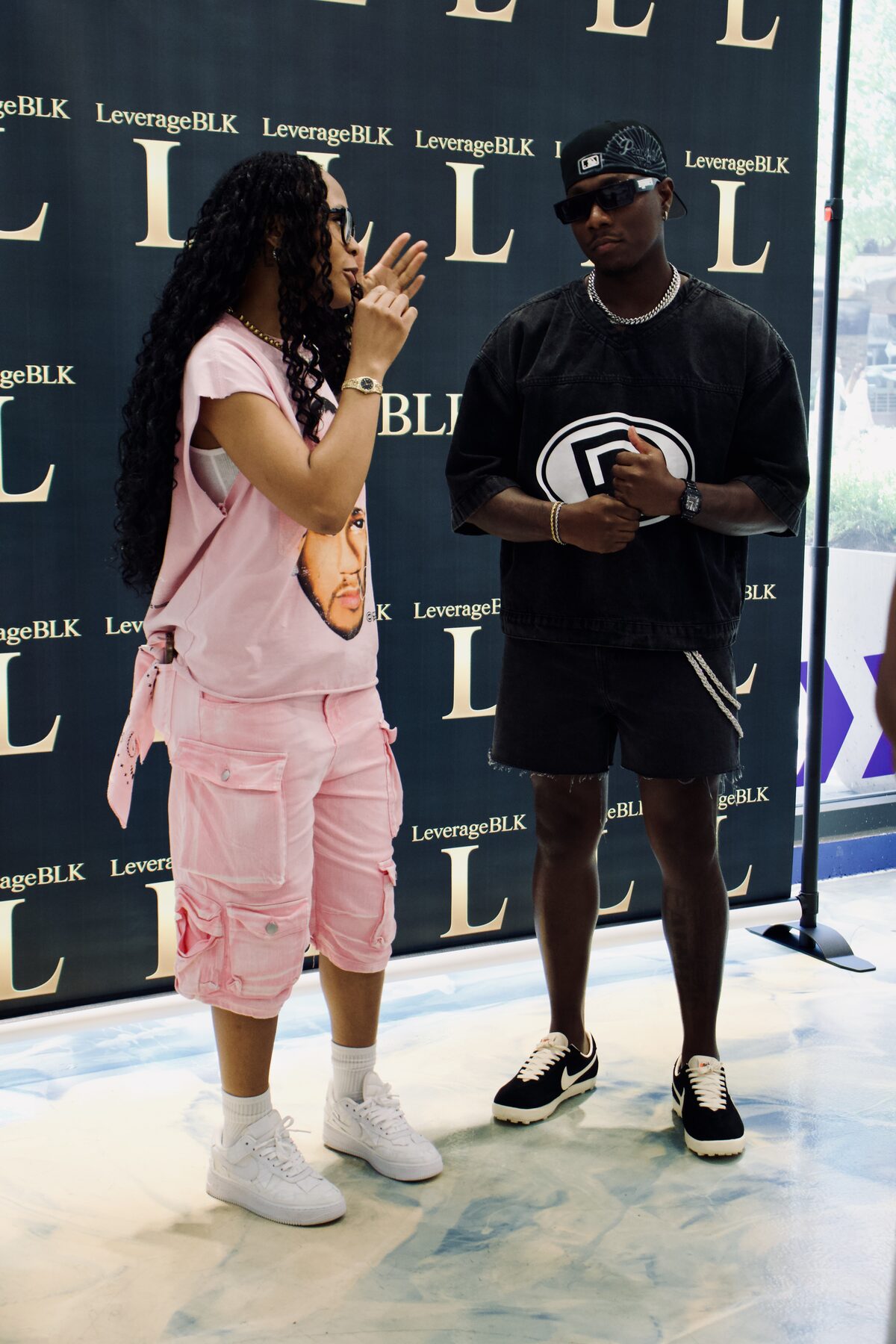 Guests mid-conversation at the step-and-repeat